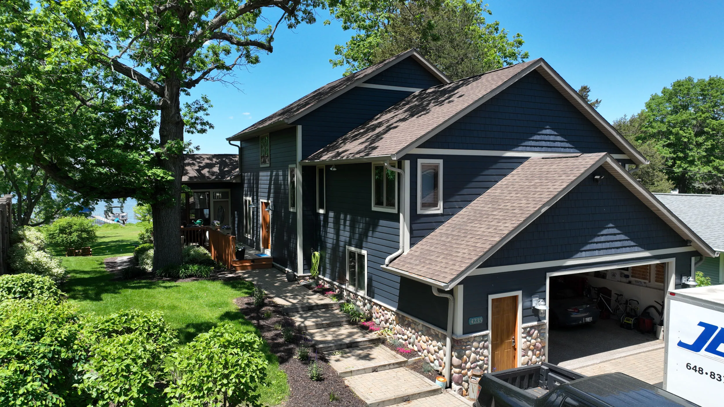 A siding project on the lake! Blue in color and a nice wooden door. 